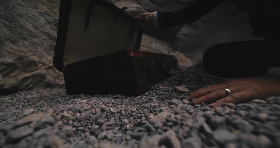A man reaching for a case thats closing