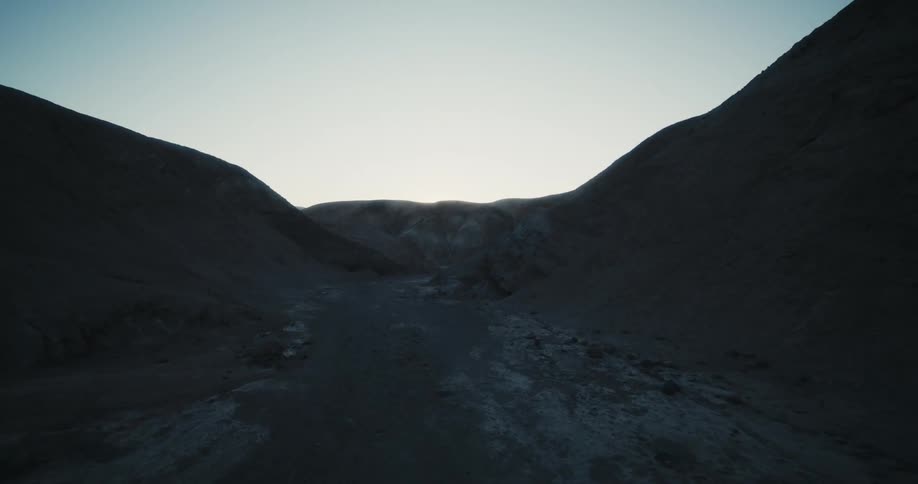 A dirt run runs through a canyon