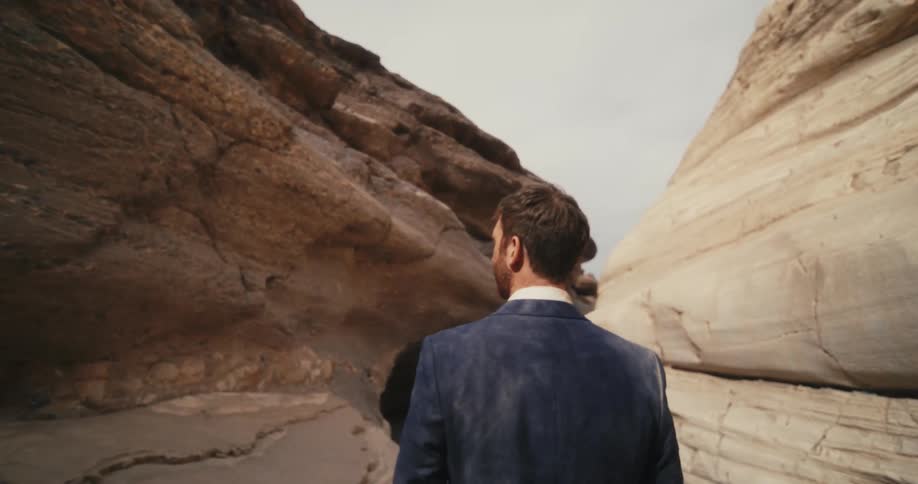A man is hiking through the caverns