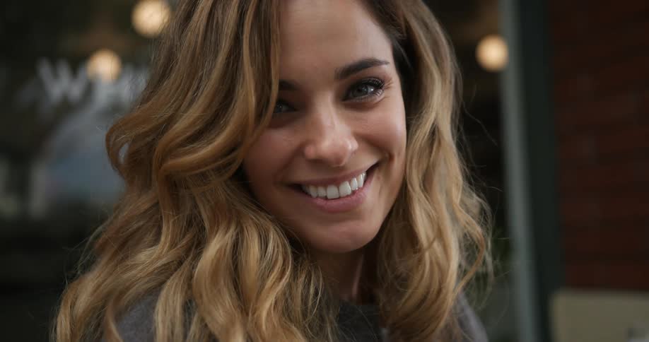 A woman smiling at the camera
