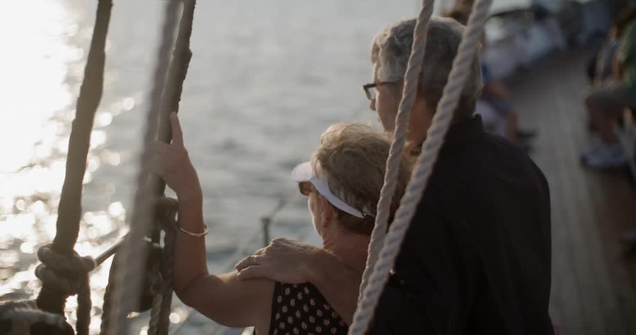 People sit on a boat as it sails