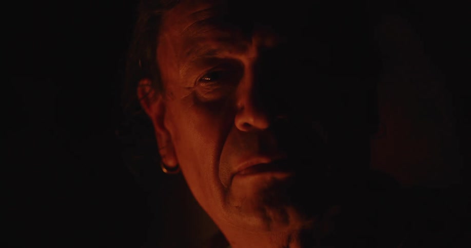 The light is flickering on the mans face
