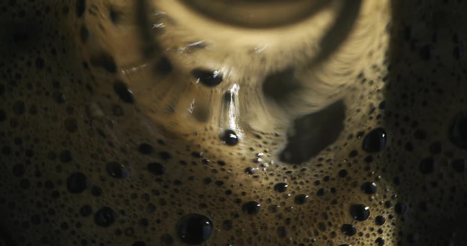 Brewed coffee spins in a machine