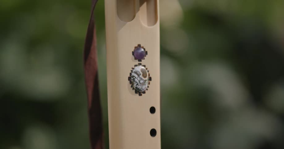 Close up of the details on a wind instrument standing outdoors