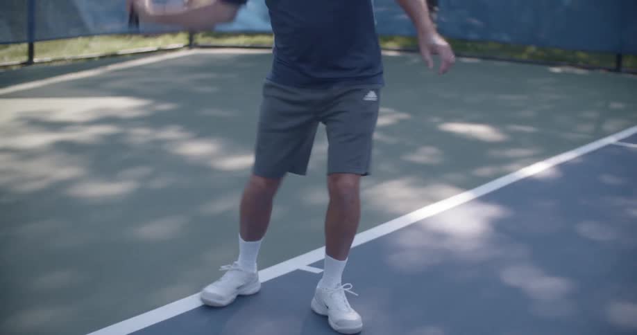 A person is playing tennis