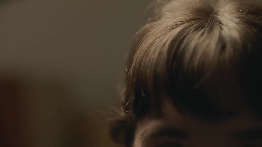 Close up of a persons short hair and eyebrows