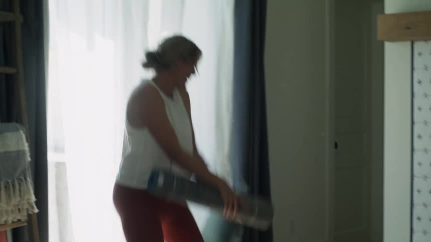Mother jumps aside with a smile as son ambushes her with a pillow