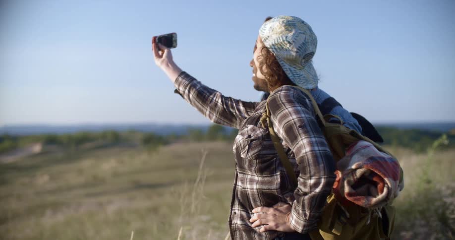 Two people take a picture outside
