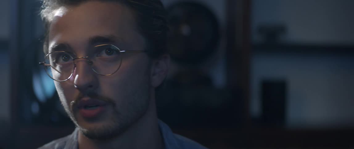 A man is talking while he watches something