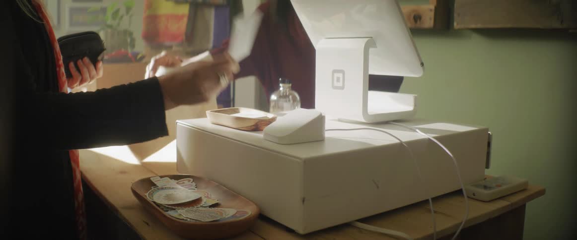 A customer buys items at the register