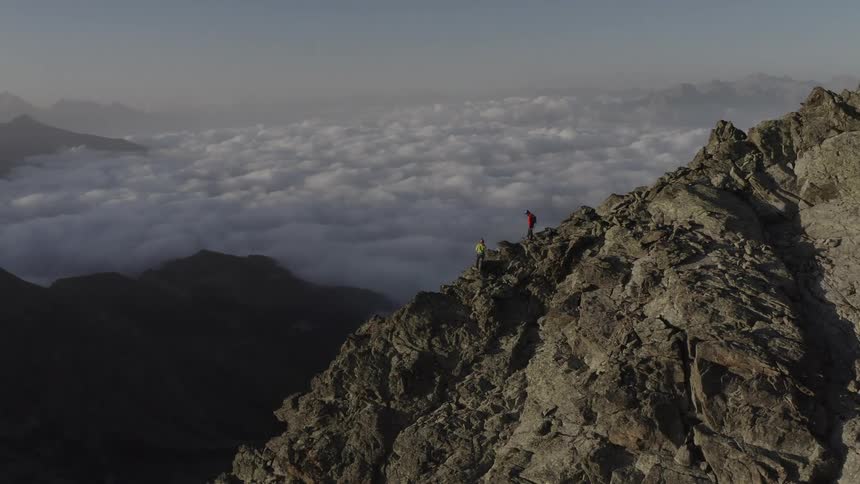 A hiker is high up on the mountain