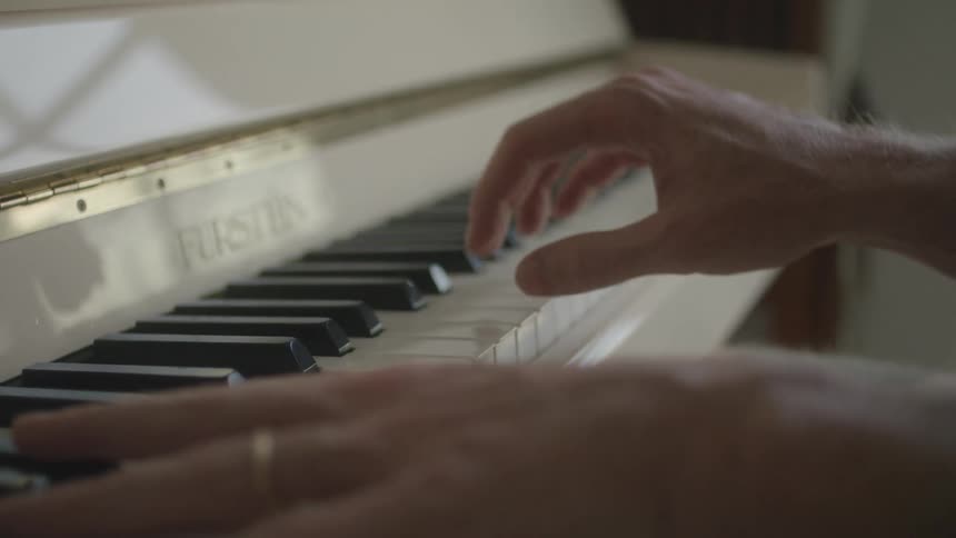 A person is playing the piano