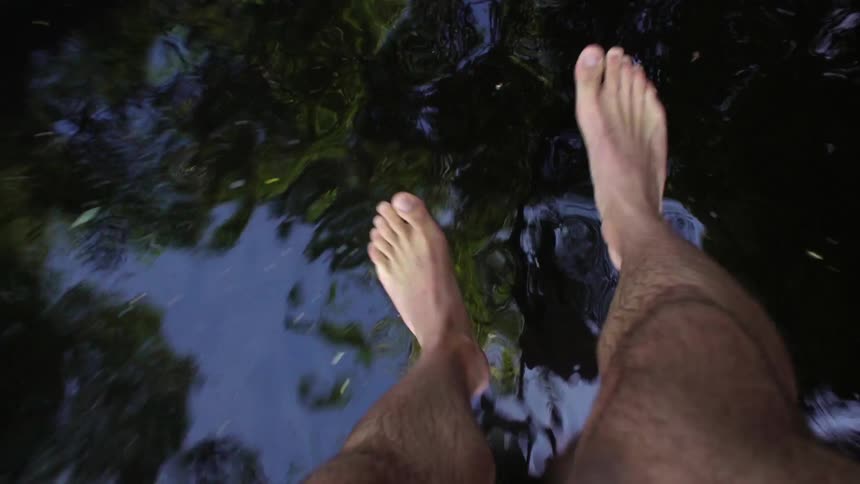 A man jumps into a lake