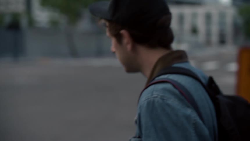 A man looks both ways before crossing the street