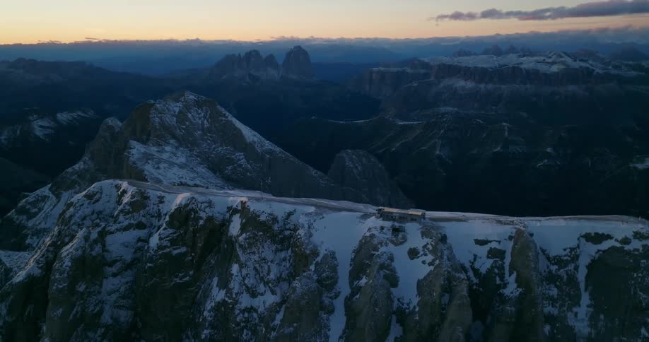 The sun is rising on the mountain range