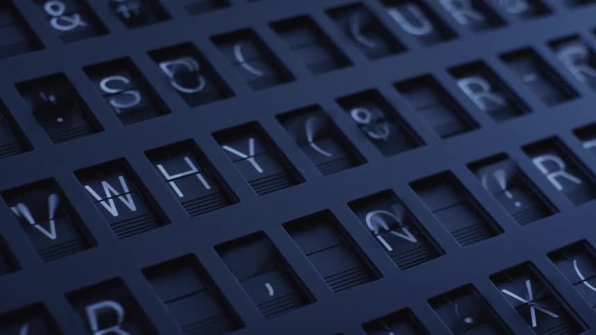 Flip display board moves through symbols before spelling the question why