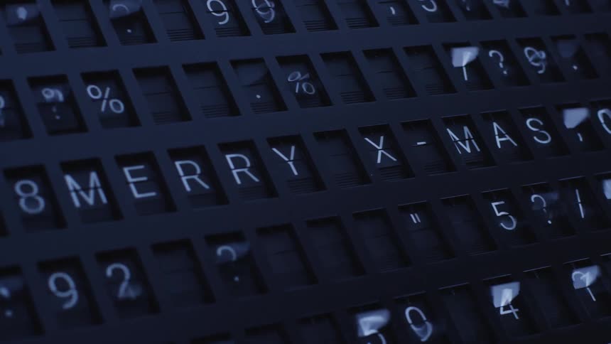 Numbers and letters spinning on a sign until it stops and spells out merry xmas