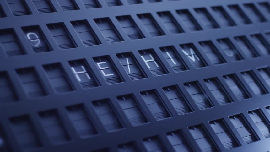 The dials on the machine flip letters and numbers