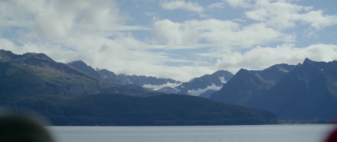 People near a lake on the mountains