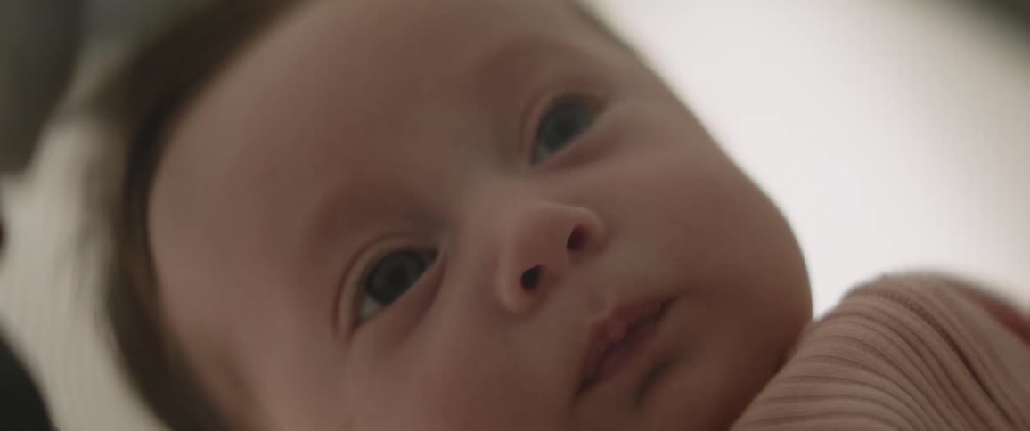 A close up of a babys head and face