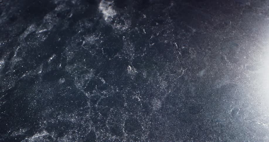 Ice cracking on a body of water