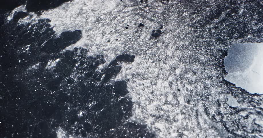 The ice moves and breaks in the water