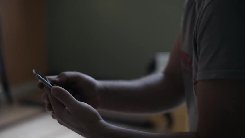 A man is using a phone