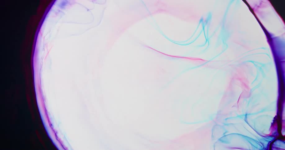 An explosion of white moves across pink and purple colors in the darkness and shrinks back down blending into the white