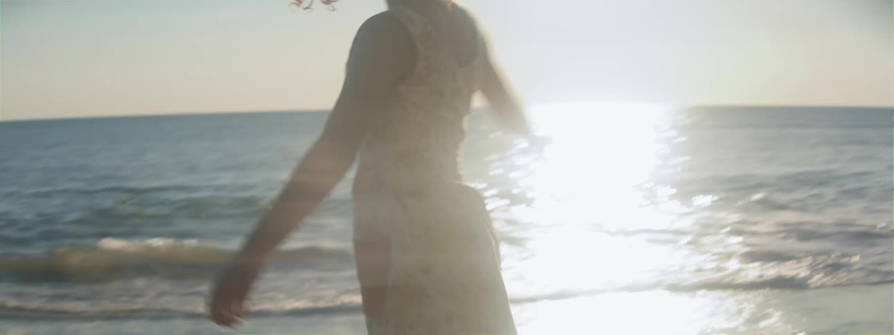 A woman dancing on the beach