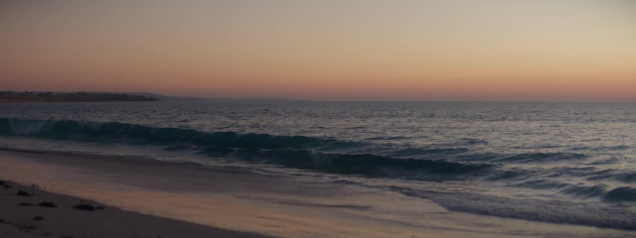 The ocean near a beach with wavy waters