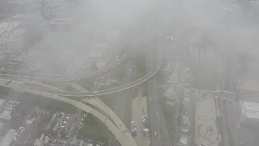 Vehicles travel on the winding roads through the city