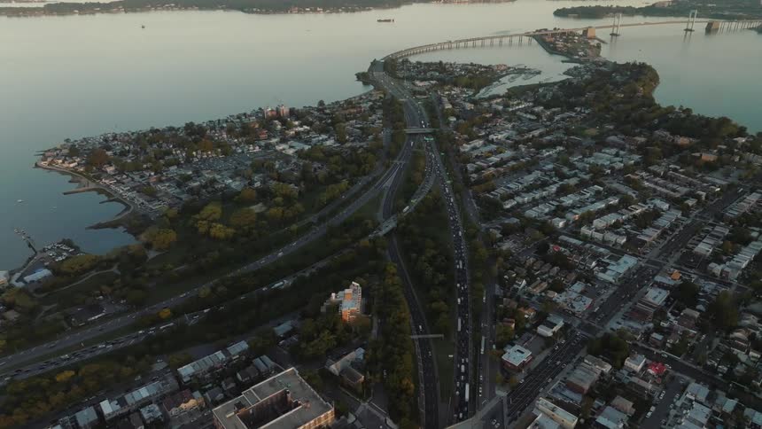 An aerial view of a coastal town with a bridge