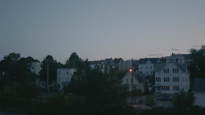 Apartment buildings and houses in the neighborhood at dusk