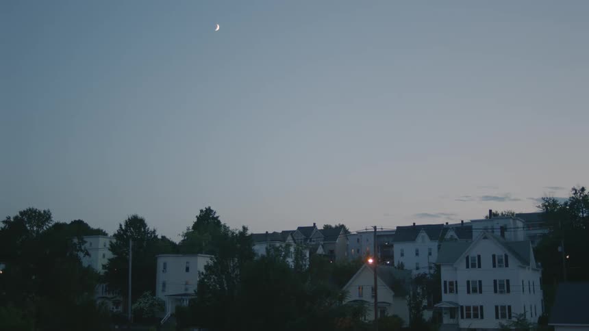 Apartment buildings and houses in the neighborhood at dusk