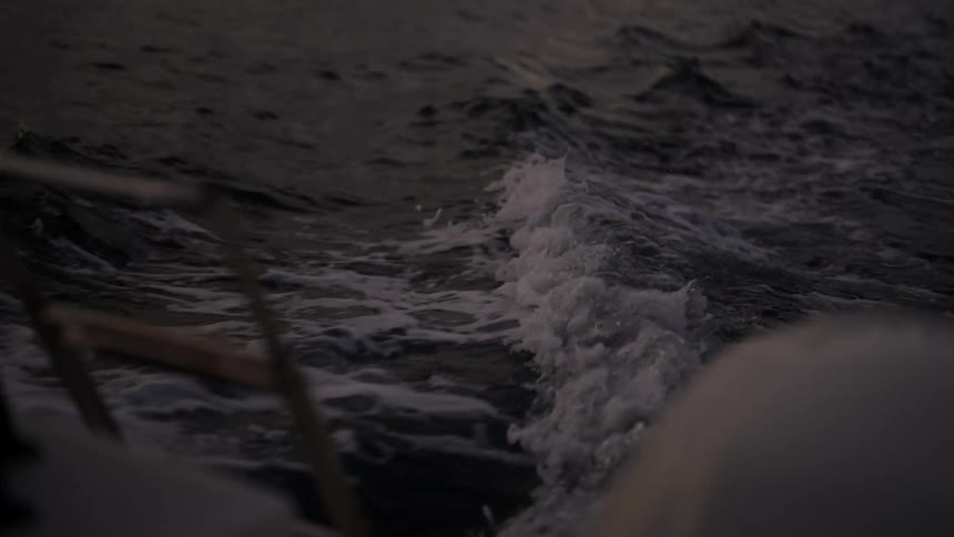 Running boat outboard motor produces bubble on water