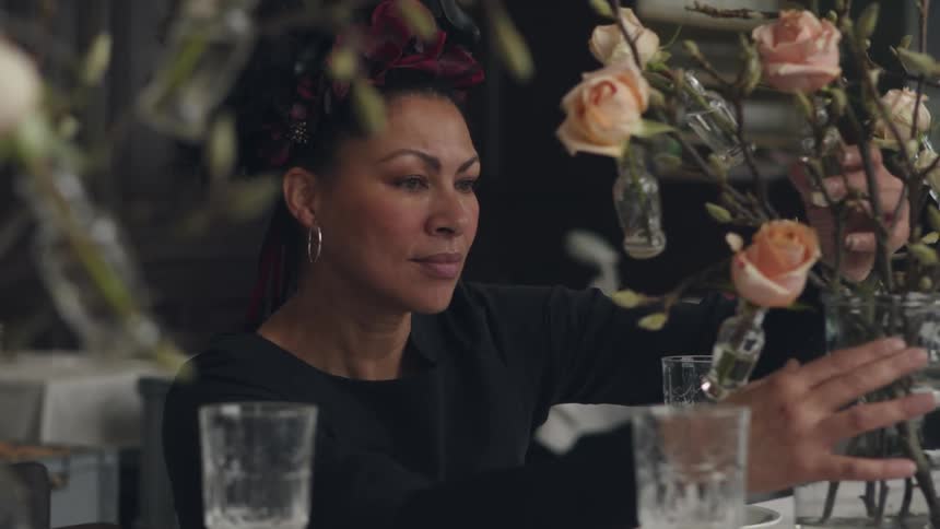 A florist is arranging flowers