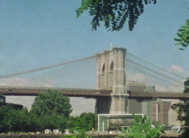 Traffic heads down a bridge past downtown