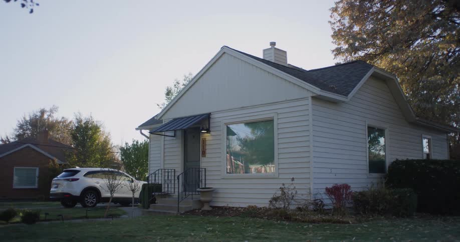 Detached house and white car in the countryside