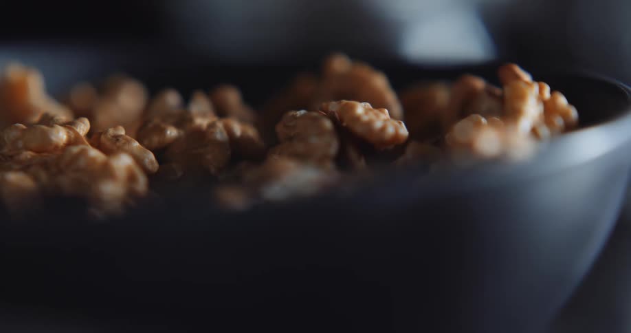 The bowl is filled to the top with walnuts