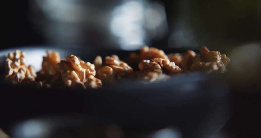 Shelled walnuts are arranged in a wide bowl