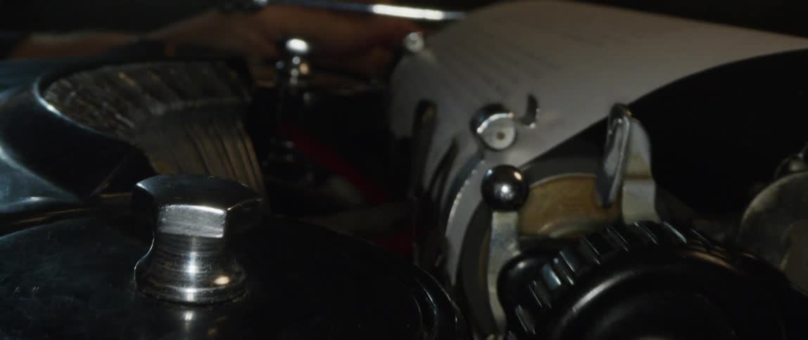 A person types on a vintage typewriter