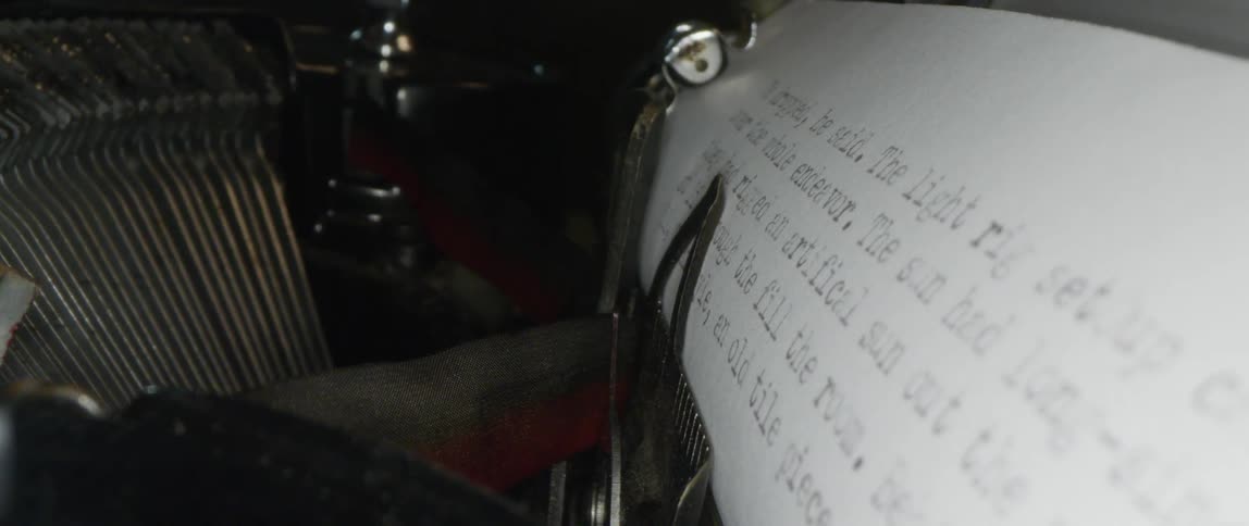 Close up of typewriter and paper with text