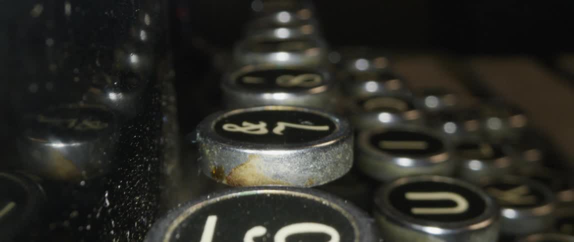 Keys on a typewriter on a wooden table