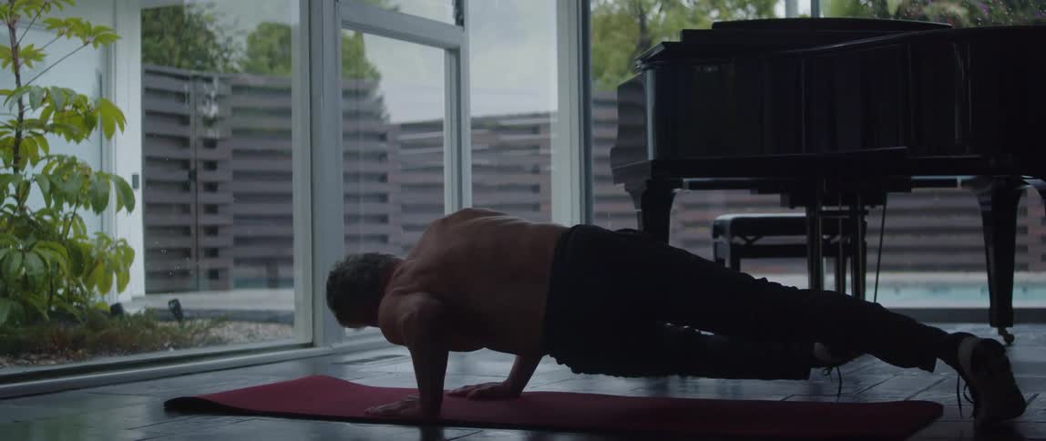A man exercises at home