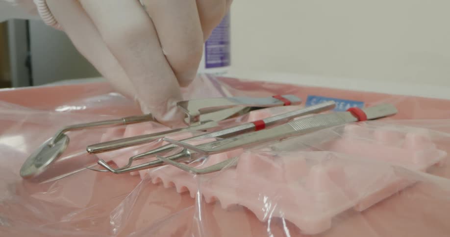 Dentist wearing gloves take mouth mirror