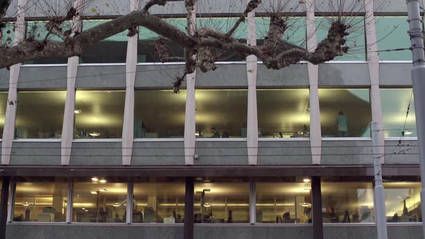 People on different floors are inside an office building
