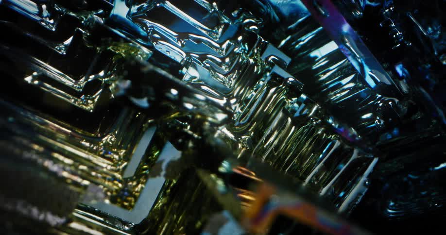 A light shines over a translucent blue crystal