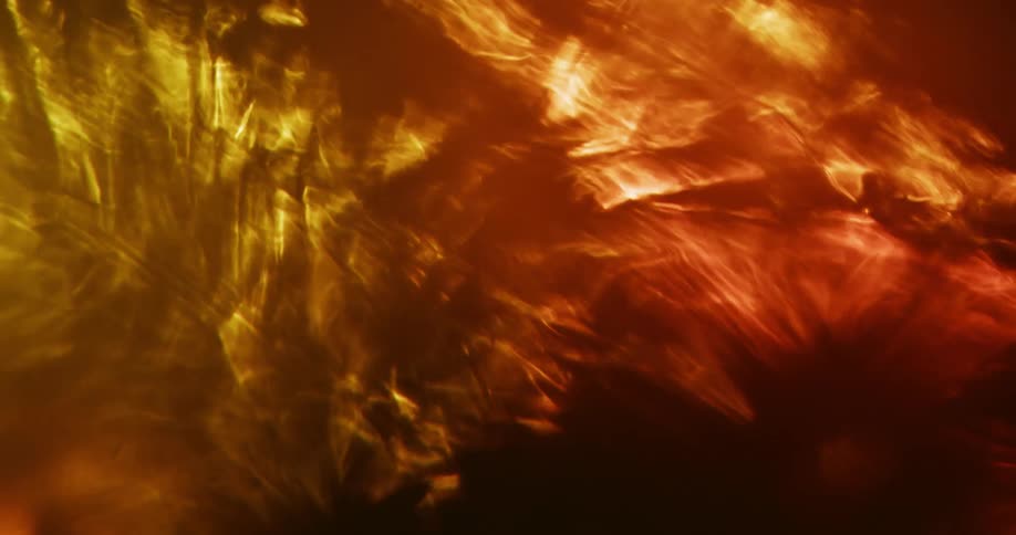 Abstract light shines on liquid flowing