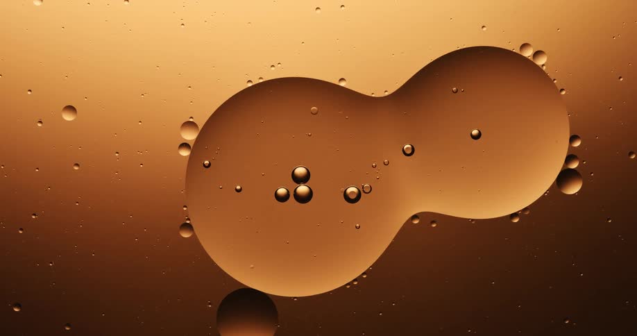 A liquid bubble is dividing and becomes two