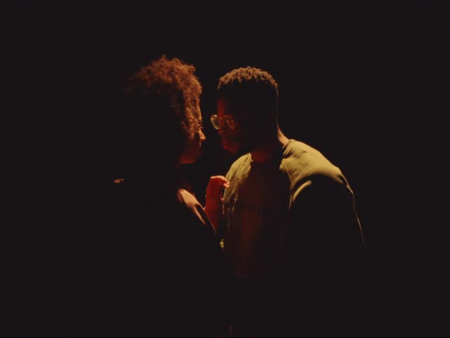 Girlfriend and boyfriend are kissing in a room